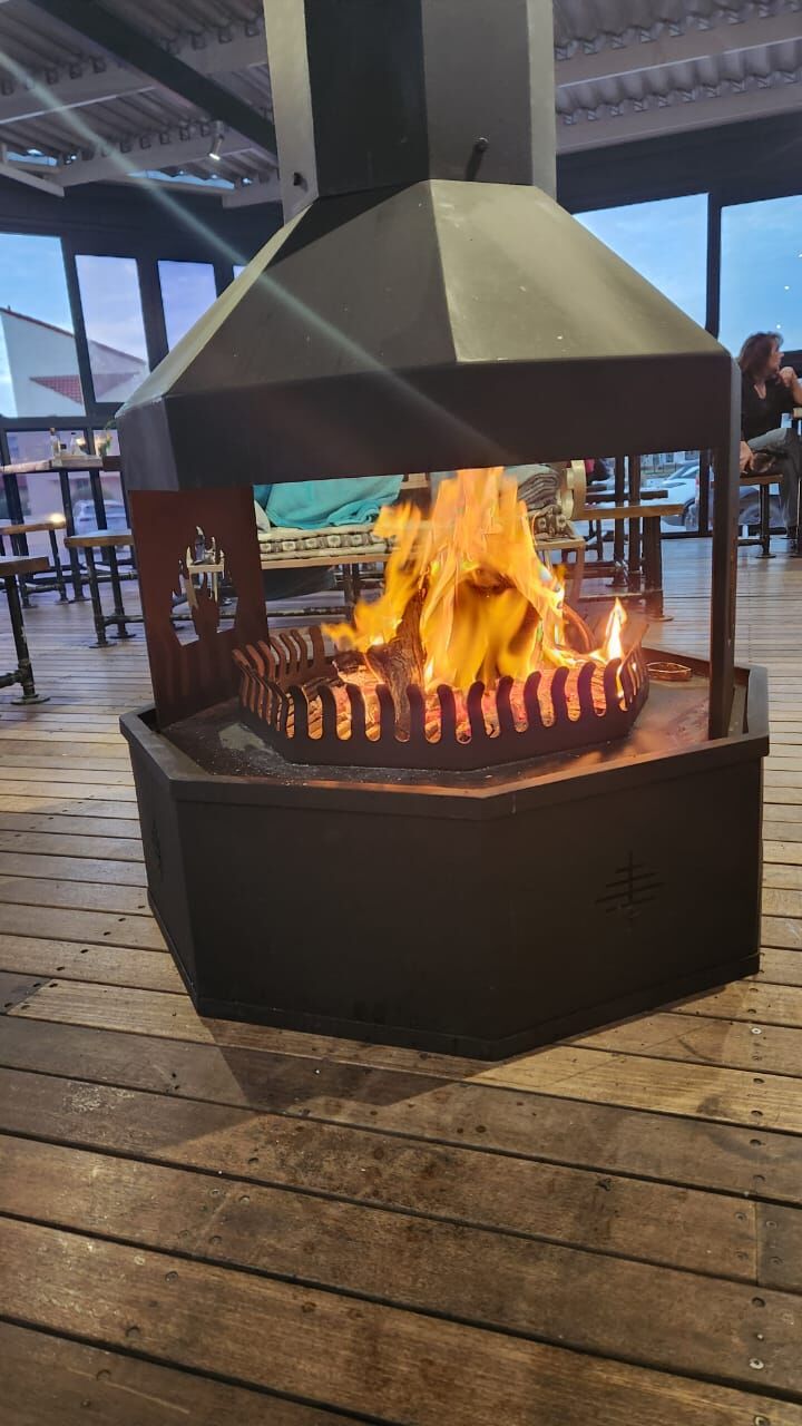 The glass fire pit burning on the patio